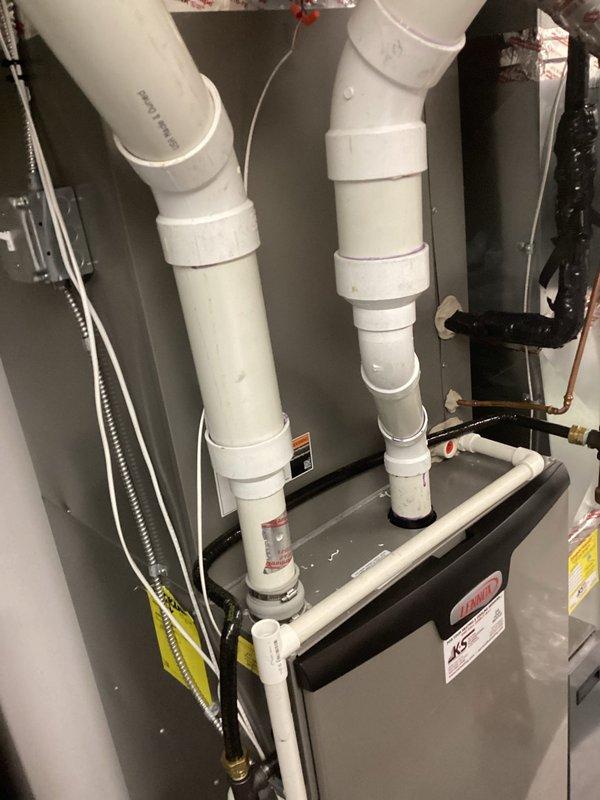 Performed scheduled preventive maintenance service on a Lennox residential HVAC system. Conducted comprehensive system tune-up with inspection of the furnace unit, venting system, and all connections. No issues were identified during the maintenance visit; system is operating normally with proper installation of PVC venting and refrigerant lines.