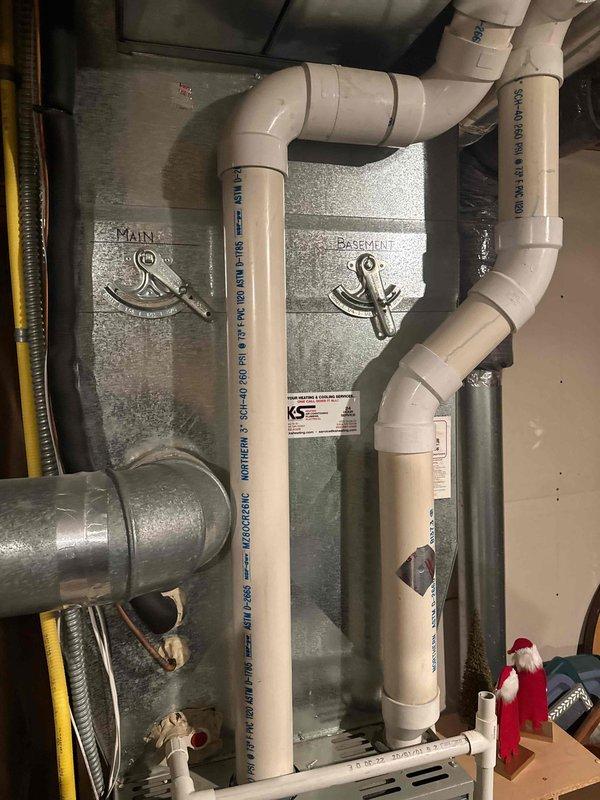 Responded to no heat complaint where customer reported thermostat/furnace not warming properly. Performed system inspection and found humidifier in off position with dampers incorrectly set for summer operation. Corrected damper positions, activated humidifier, and verified proper thermostat/furnace operation. System testing confirmed 18° delta T, however heat exchanger shows signs of condensate leakage; recommended furnace replacement with 2-stage unit due to observed corrosion.