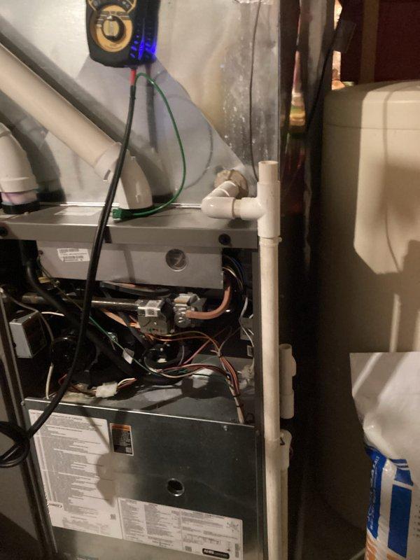 Performed routine HVAC tune-up service during scheduled 8-12 appointment window, calling customer in advance as requested. Conducted comprehensive system inspection and maintenance of furnace unit with connected PVC ventilation/drainage assembly and refrigerant lines. All components verified to be in proper working condition; no issues identified during service.