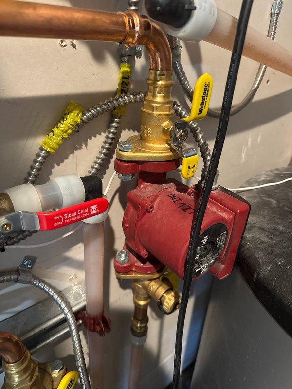 Arrived to assess in-floor heating issue where certain areas of the home were not properly heating. Inspected IBC boiler system and associated piping network. Diagnosed insufficient flow in living room loop; adjusted circulation pump from medium to high speed setting to improve heat distribution throughout the zone.