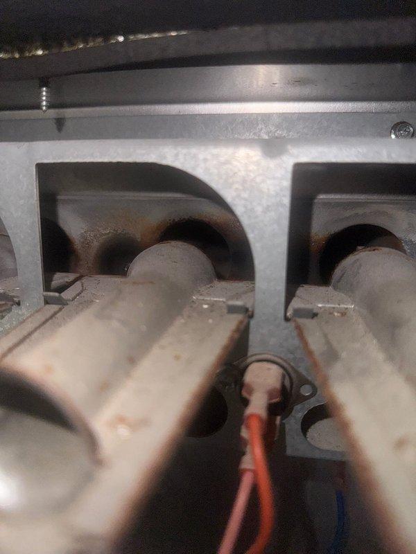 Responded to no heat call for aging furnace. Diagnosed clogged condensate line with soot buildup, which prevented proper pressure formation. Inspection revealed damaged secondary heat exchanger was the root cause. Provided options for both repair and complete system replacement.