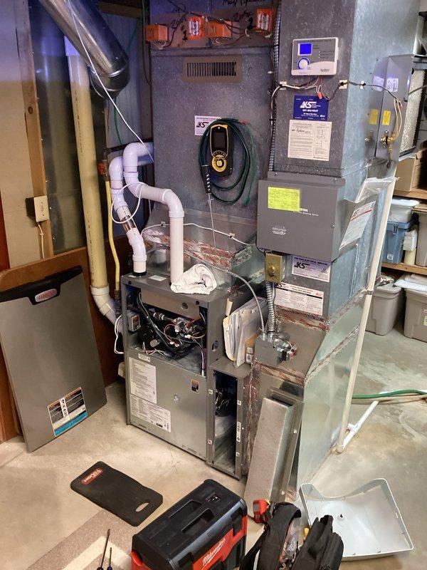 Performed scheduled preventative maintenance agreement service on residential furnace system. Inspected internal wiring connections and noted minor corrosion on metal housing near the wire bundle. System appears to be functioning as designed with no major issues requiring immediate attention.