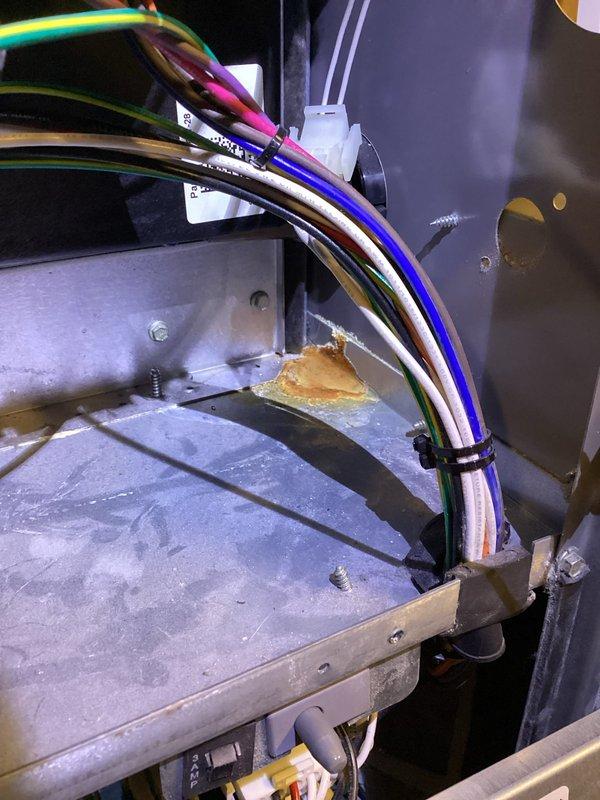 Performed scheduled preventative maintenance agreement service on residential furnace system. Inspected internal wiring connections and noted minor corrosion on metal housing near the wire bundle. System appears to be functioning as designed with no major issues requiring immediate attention.