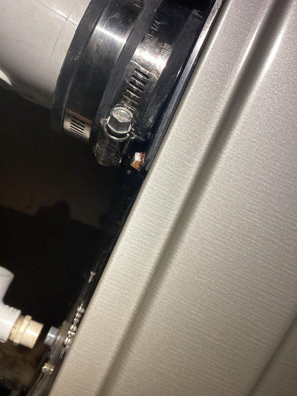 Responded to furnace service call for reported condensation drain leak. Diagnosed and repaired leaking PVC condensate drain pipe by applying adhesive to seal joint. Also identified loose exhaust boot connection and secured by tightening the metal hose clamp to restore proper sealed connection.