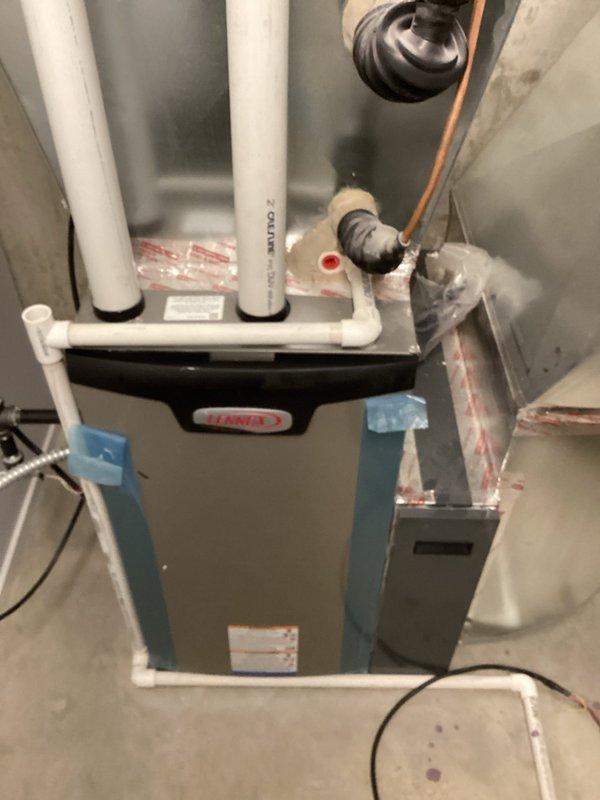 Completed finalization of zoning system installation on Lennox furnace unit. Installed and verified proper electrical connections for zone control equipment including junction box with indicator light. All venting and copper line connections properly secured and system operational after previous visit to address zoning issues.