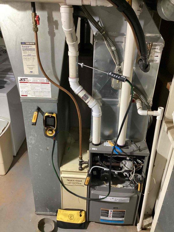 Completed scheduled preventive maintenance agreement service on blower motor assembly. Conducted comprehensive inspection of furnace system, including white PVC ventilation pipes, copper refrigerant lines, and drainage connections. Observed and documented some moisture-related concerns in adjacent utility area that may require future attention.