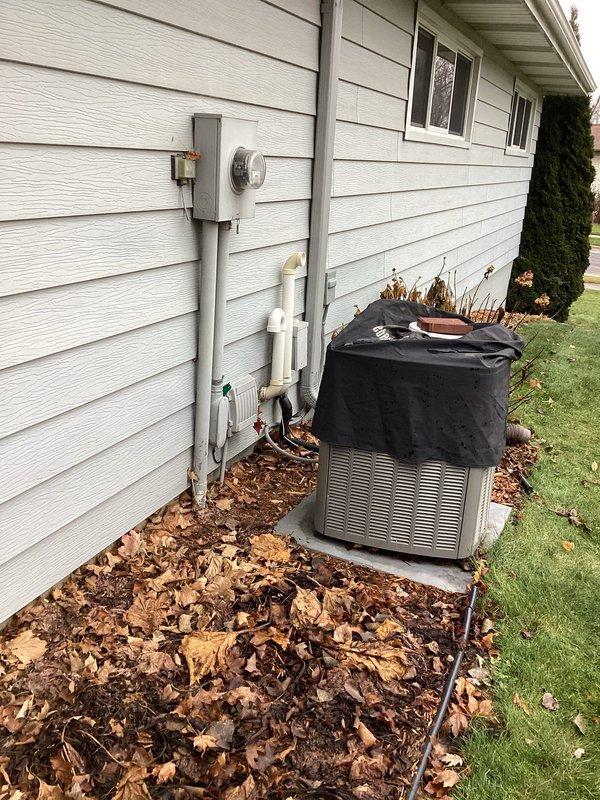 Performed scheduled preventive maintenance agreement service on residential gas furnace. Inspected furnace components including circuit board and wiring. Also verified condition of exterior heat pump/AC unit, which was properly covered for seasonal protection.