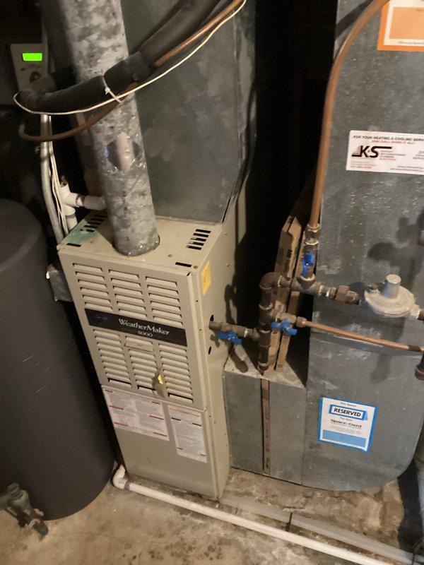 Responded to service call for a Carrier WeatherMaker 8000 furnace making loud noise during operation. Upon inspection of the system, discovered a mouse had entered the blower assembly. Removed the rodent from the blower compartment, restoring normal operation and eliminating the noise issue. System is now functioning properly with adequate heat production.