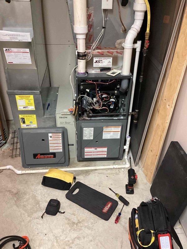 Diagnosed intermittent heating issues on Trion Air Bear furnace. Discovered dirty flame sensor causing ignition problems and a chattering pressure switch measuring 0.10 WC. Serviced unit by cleaning flame sensor and bypassing faulty pressure switch to restore proper heating operation.