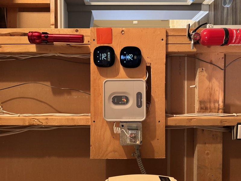 Installed complete zoning system for improved climate control, including 4 new thermostats, 4 zone damper motors, and zone control boards. Confirmed proper installation of central control gateway and verified temperature readings across all zones. System fully operational with proper wiring connections to existing HVAC infrastructure.