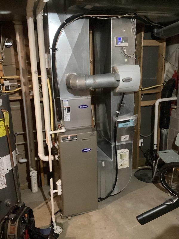 Diagnosed intermittent control board failure on aging Carrier furnace causing short cycling and no heat condition. Performed system evaluation via visual inspection of flame sensor and observation of system operation. Recommended replacement of control board or full system replacement due to equipment age exceeding 10 years.