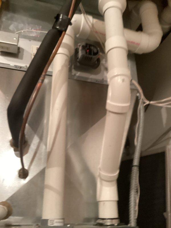 Completed scheduled tune-up service on Trane furnace system. Performed comprehensive inspection and maintenance of the air handler unit. System includes an AprilAire accessory unit (likely humidifier/air cleaner) with standard PVC venting configuration. Equipment was found in satisfactory operating condition with no issues requiring repair.