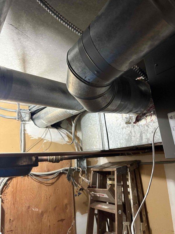 Responded to call back regarding heat distribution issues across multiple floors. Inspected ductwork system and found improper airflow balance with majority of air directed to 3rd floor. Installed baffles in main trunk line to properly regulate airflow distribution between all floors, restoring normal heating function to 1st and 2nd levels.