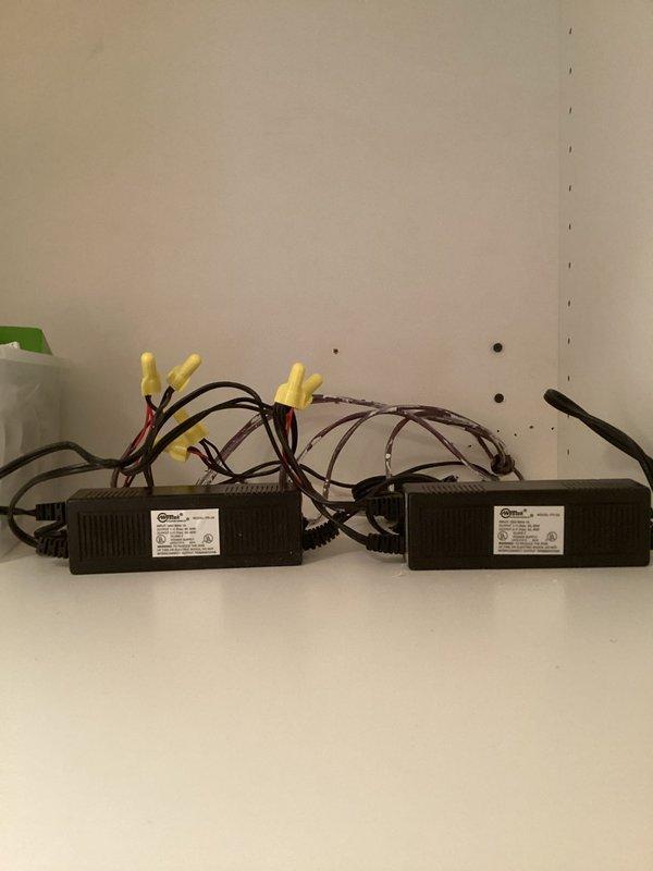 Diagnosed and replaced faulty LED drivers powering kitchen puck lights after customer's bulb replacement attempts failed to restore function. Accessed power supply components through cabinet access panel, installed new compatible drivers, and confirmed proper operation of all kitchen cabinet lighting fixtures.