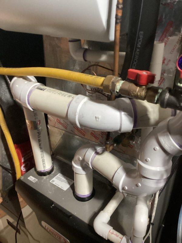 Performed scheduled tune-up on Lennox furnace and discovered cracked heat exchanger. Red-tagged unit due to safety hazard and discussed replacement options with customer, who agreed to proceed with heat exchanger replacement. Inspection included verification of proper venting configuration and connection integrity of the plumbing components.
