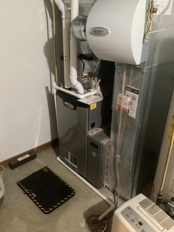 Responded to emergency no-heat call for 7-year-old furnace system in basement zone of two-zone system. Inspected thermostat location in hallway and verified damper operation, confirming proper airflow to basement. Determined issue was temperature differential between rooms with windows cooling faster than the hallway where thermostat is located rather than equipment malfunction.