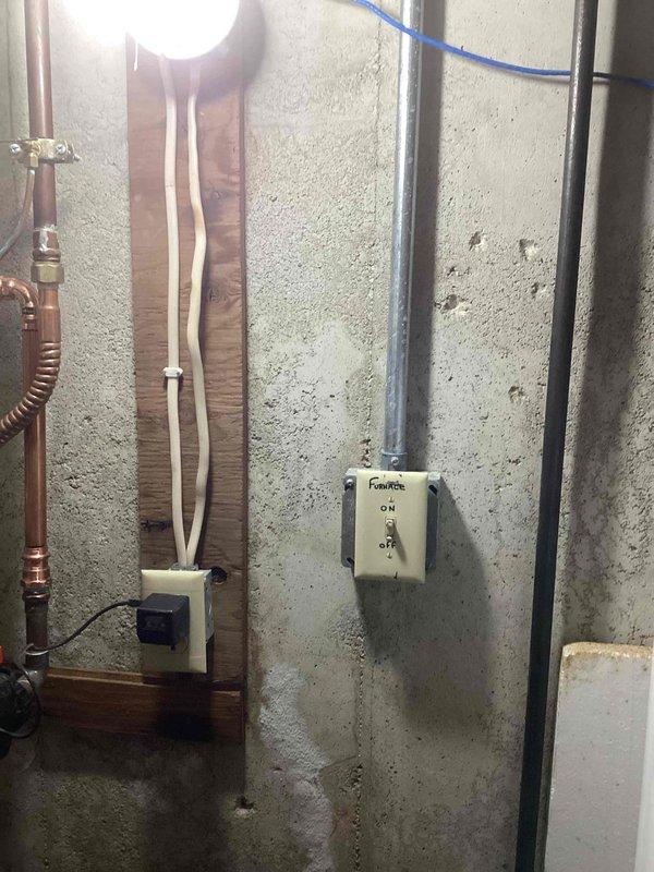 Responded to no-heat emergency call. Located furnace switch in utility room that had been flipped to OFF position. Restored heat by returning switch to ON position after verifying breaker condition was satisfactory.