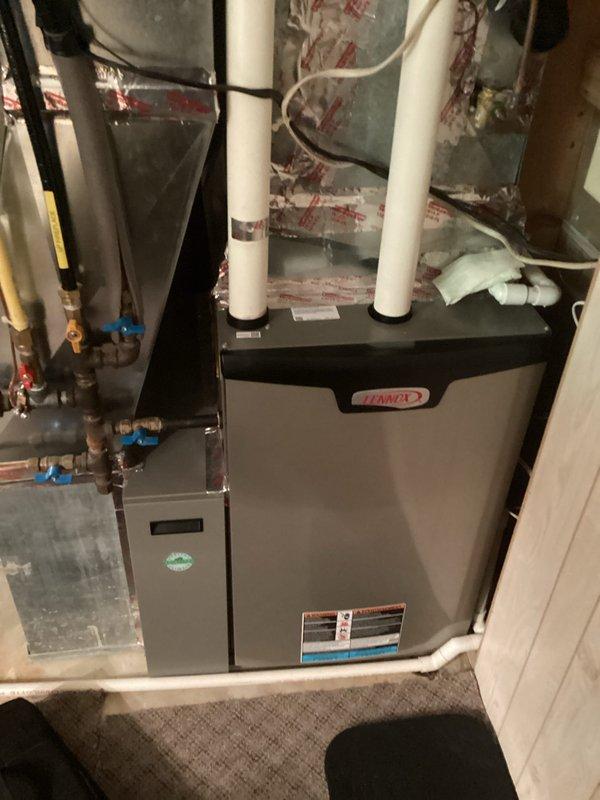 Performed scheduled tune-up on Lennox air handler system. Inspected all components including PVC exhaust pipes, copper lines, and ductwork connections. System functioning properly with no issues identified; completed standard maintenance procedures.