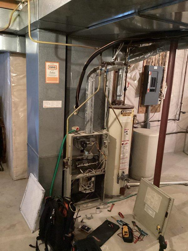 Responded to no-heat service call for older furnace system. Diagnosed two issues: contaminated flame rod preventing proper flame sensing and failed blower motor capacitor. Service included cleaning the flame rod to restore proper ignition sequence and replacing the blower motor capacitor to restore proper fan operation. System functioning normally upon completion.
