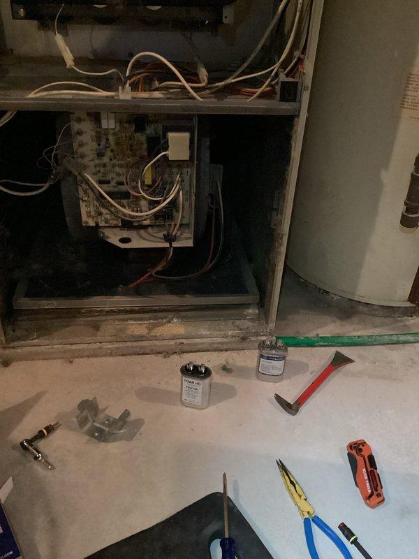 Responded to no-heat service call for older furnace system. Diagnosed two issues: contaminated flame rod preventing proper flame sensing and failed blower motor capacitor. Service included cleaning the flame rod to restore proper ignition sequence and replacing the blower motor capacitor to restore proper fan operation. System functioning normally upon completion.