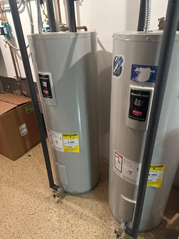 Installed iron filter system with digital Impression control panel, connected to existing water treatment equipment and pressure tank. System was properly configured with appropriate copper piping and electrical connections to address iron content in water supply.