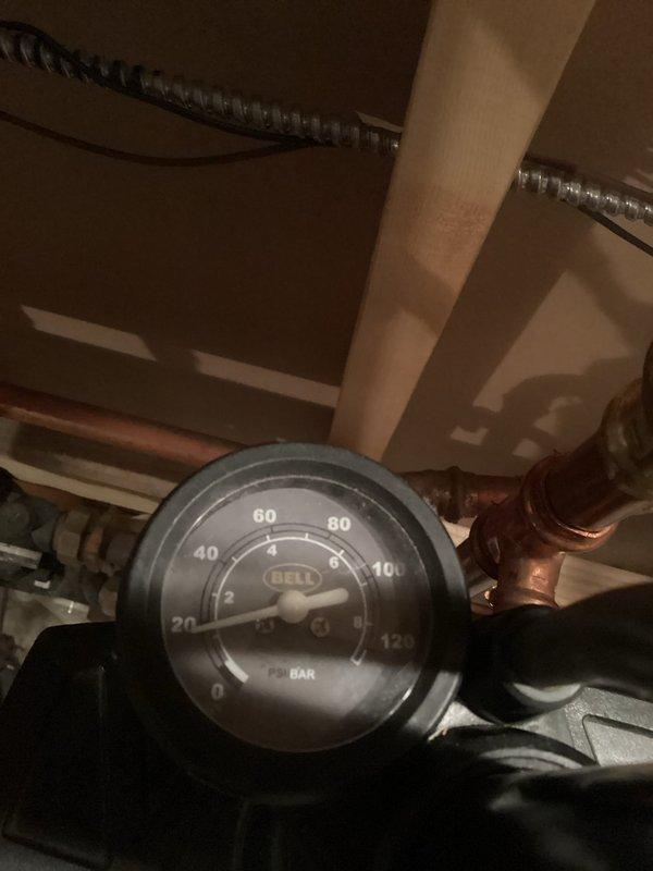 Responded to service call for boiler leaking from relief valve. Diagnosed waterlogged expansion tank and excessive system pressure at 32 psi. Corrected by draining system pressure to 15 psi and recharging expansion tank to restore proper operation.