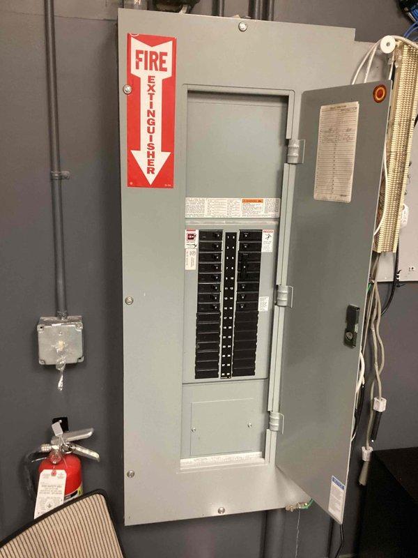 Arrived within scheduled timeframe and diagnosed faulty T8 ballast in ceiling fixture. Replaced defective ballast with new unit, restoring proper lighting function. Inspected electrical panel to ensure proper circuit operation.