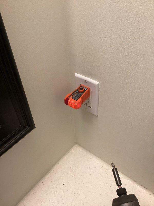 Addressed multiple code violations identified during home inspection. Corrected improperly wired GFCI outlet in upstairs bathroom by reversing hot and neutral wires. Installed GFCI protection for washing machine outlet as required by code. Eliminated double-tapped breaker by pigtailing kitchen/dining lights hot wire and transformer wire to ensure only one wire connection per breaker terminal.