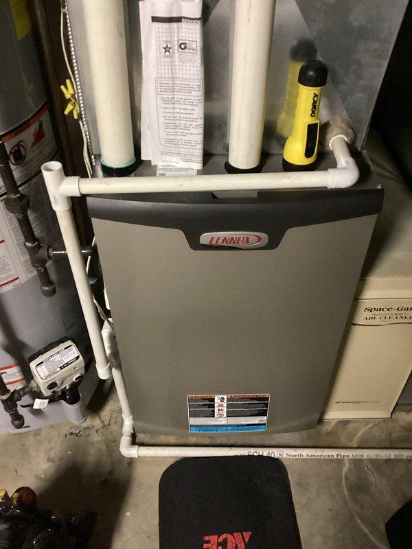 Performed standard tune-up service on a Lennox air handler system. Conducted comprehensive inspection of the furnace unit, Space-Gard air cleaner, and PVC venting assembly. All components were found to be in proper working condition with no operational issues identified.
