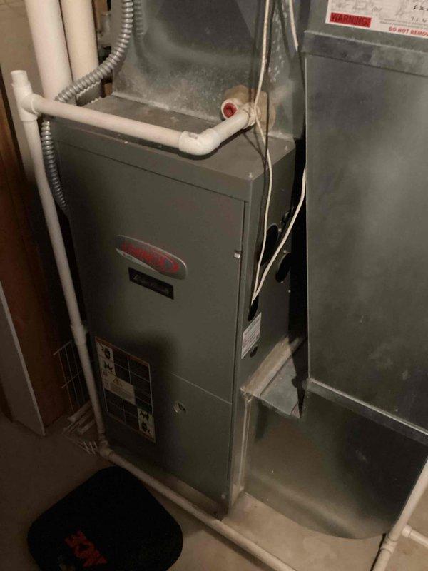 Completed scheduled furnace tune-up on Lennox system located in utility area. Performed comprehensive system inspection including PVC venting/drainage components and electrical connections. All maintenance procedures were completed successfully with no issues found.