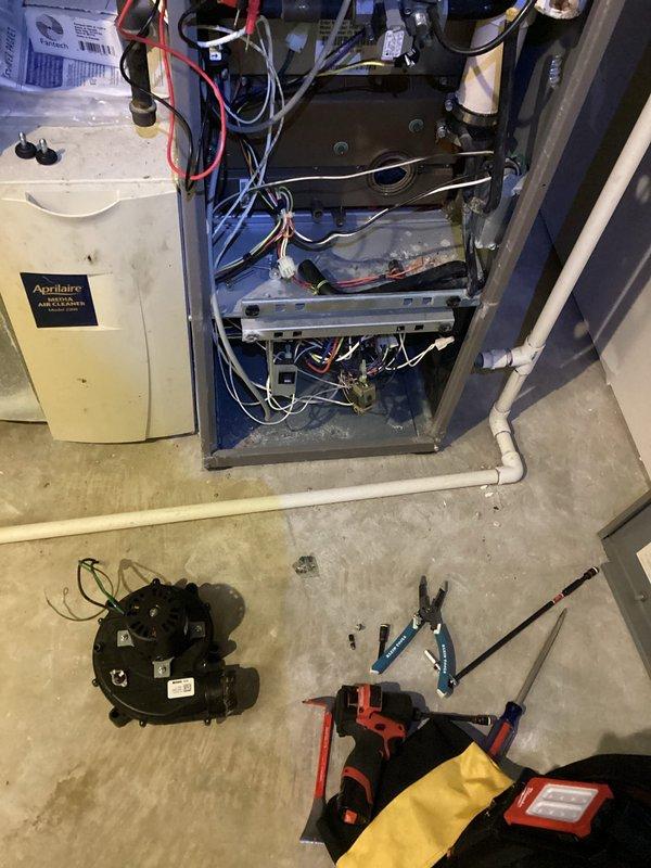 Responded to emergency no-heat call and diagnosed bent inducer motor shaft causing insufficient draft. Opened furnace panel to inspect internal components, including control board and wiring. Due to unit age and repair cost comparison, recommended complete system replacement rather than repair of the defective inducer assembly.