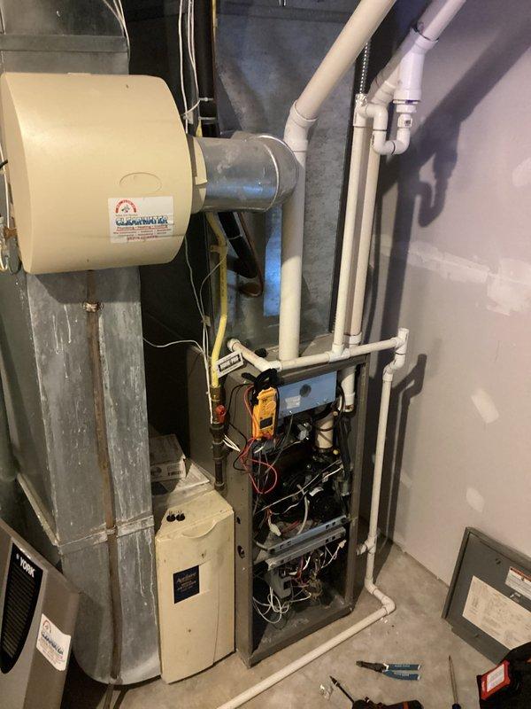 Responded to emergency no-heat call and diagnosed bent inducer motor shaft causing insufficient draft. Opened furnace panel to inspect internal components, including control board and wiring. Due to unit age and repair cost comparison, recommended complete system replacement rather than repair of the defective inducer assembly.