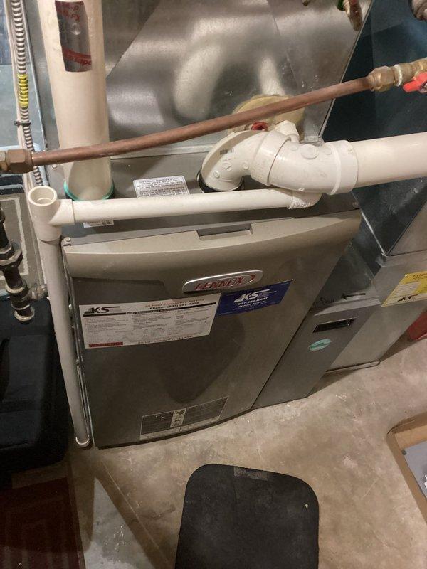 Completed scheduled maintenance on Lennox heating system under PMA. Performed comprehensive tune-up on the furnace unit with KS branding. All components, including PVC ventilation/drainage system and copper line connections, were inspected and functioning properly. System left in clean, well-maintained condition.