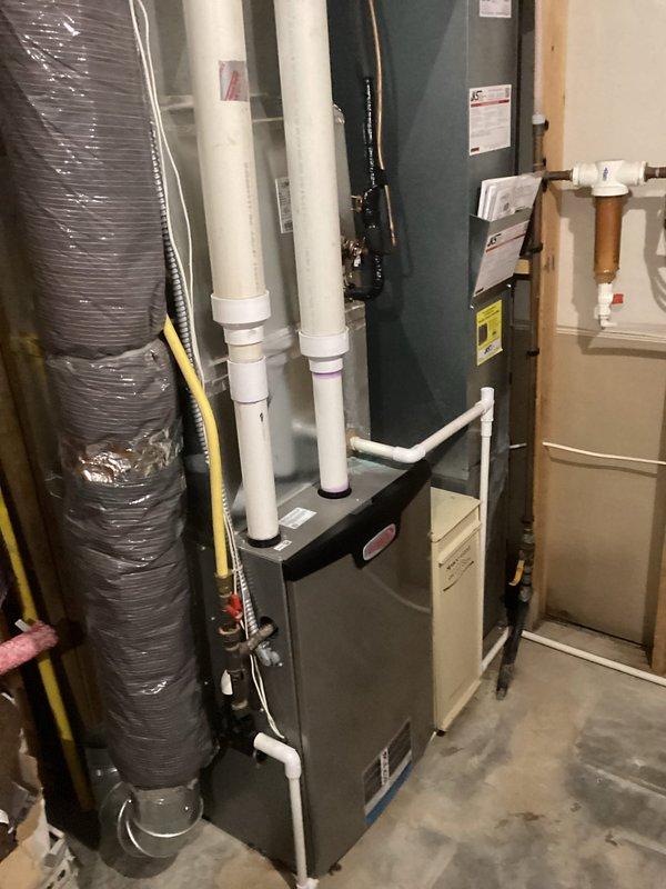 Responded to no heat service call. Diagnosed system with plugged intake pipe causing operational failure. Discovered significant mineral buildup and scale on vent system components. Successfully cleared intake blockage, restoring proper airflow and system operation.