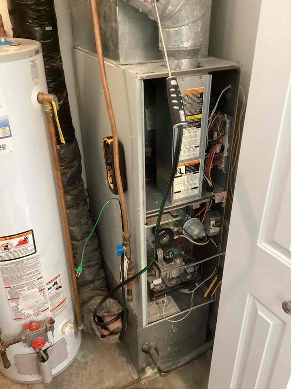 Performed annual preventive maintenance agreement tune-up on customer's HVAC system. Arrived between 12-4 as scheduled and notified customer before arrival. Inspected furnace and water heater in mechanical room, completed standard maintenance procedures with no issues detected. System operating properly after service.