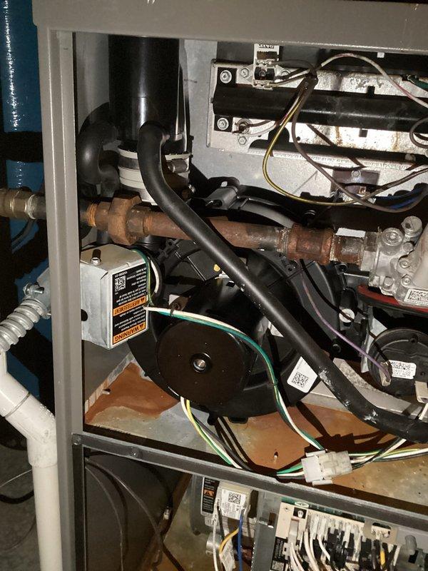 Diagnosed excessive noise from Lennox furnace system; determined inducer motor failure was the source of the issue. Removed access panel to inspect internal components and replaced defective inducer motor assembly. System now operating normally with proper ventilation and no unusual noise.