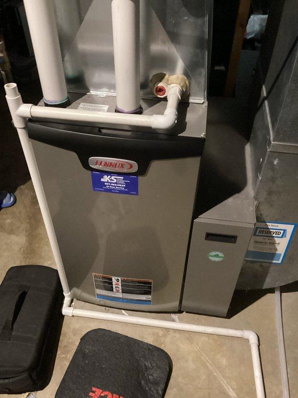 Performed scheduled maintenance tune-up on Lennox furnace system. Completed full inspection with no issues found. System is operating normally with proper connections to ventilation and exhaust components.