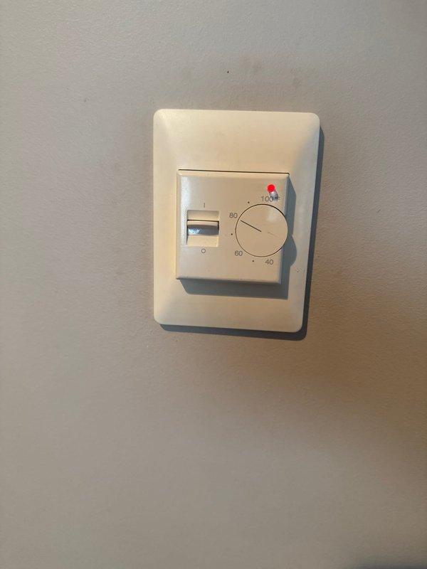 Responded to service call for in-floor heating system with two zones where one zone was not providing heat to the basement area. Inspected thermostats controlling both zones and found they were operational but required dial manipulation to activate heating. Identified thermostat model for potential replacement, though customer opted to defer replacement and will contact for follow-up if needed.