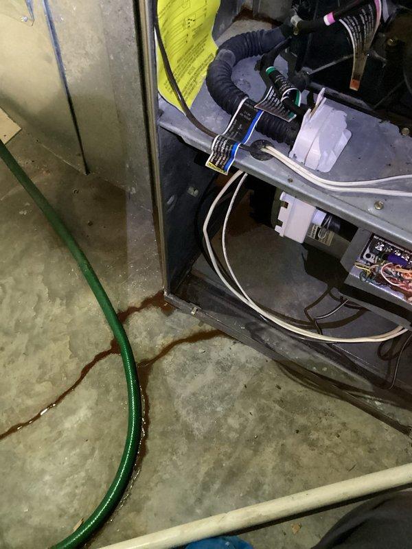 Responded to service call for furnace leaking water. Diagnostic testing with Fieldpiece C161 Combustion Analyzer revealed a failed heat exchanger, confirmed by presence of rusty liquid discharge and water pooling at unit base. Recommended complete system replacement due to unit age and economically unfavorable repair cost comparison.
