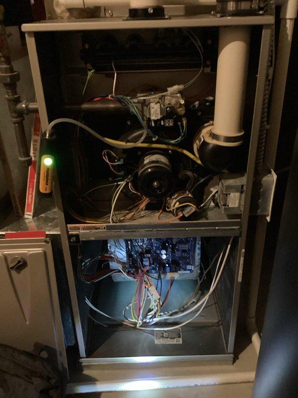 Performed scheduled tune-up on air handler system with successful results. Inspected blower motor assembly, control board connections, and associated wiring in both upper and lower compartments. Unit was found to be operating properly with good electrical connectivity as indicated by illuminated indicator light.