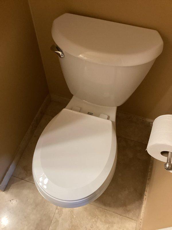 Removed and disposed of 4 existing toilets, then installed 4 new American Standard round front toilet units. Successfully completed all plumbing connections, filled systems, and verified proper operation with no leaks.
