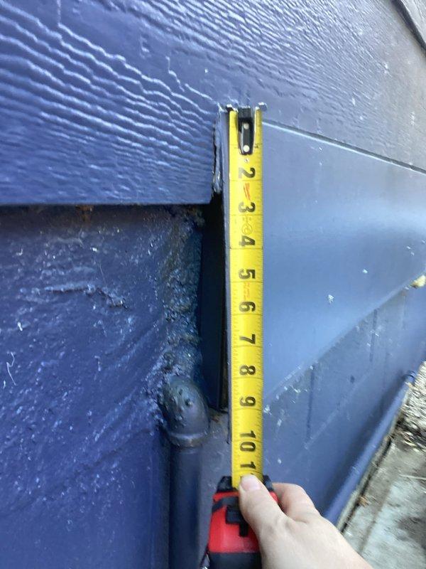 Arrived at site as scheduled and took detailed measurements of the exhaust cap, obtaining both vertical (10-11") and horizontal (approximately 53") dimensions. Observed some deterioration in the blue exterior siding surrounding the exhaust area. Photos were taken to document measurements for Bruce and Tod to prepare replacement estimates.