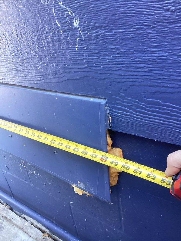 Arrived at site as scheduled and took detailed measurements of the exhaust cap, obtaining both vertical (10-11") and horizontal (approximately 53") dimensions. Observed some deterioration in the blue exterior siding surrounding the exhaust area. Photos were taken to document measurements for Bruce and Tod to prepare replacement estimates.