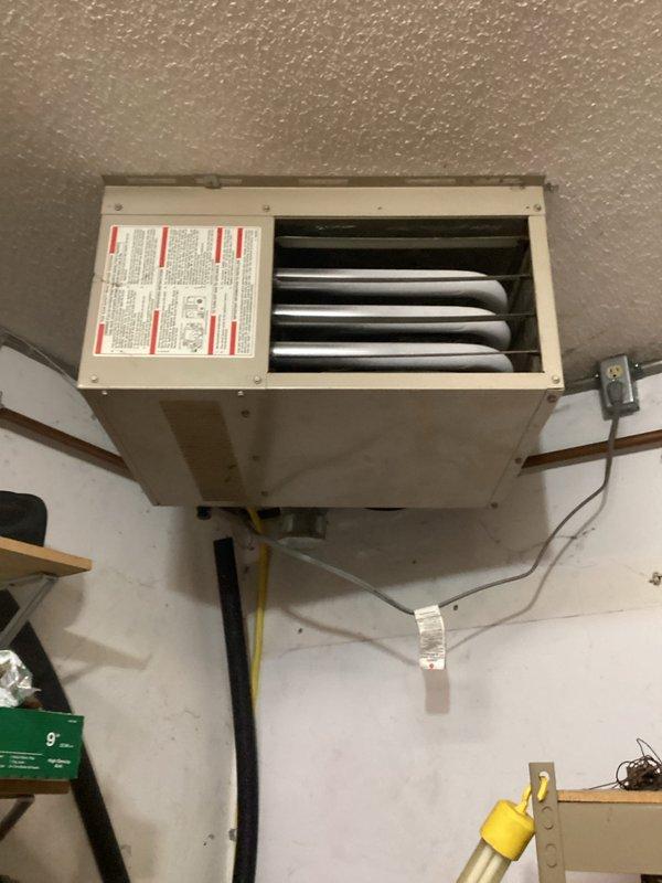 Responded to customer report of surge sound from garage heater during shutdown. Upon inspection of the wall-mounted unit, no abnormal sounds were detected during operation. Visual examination of heat exchanger, electrical connections, and gas line showed all components in normal working condition. No service actions required at this time as system is functioning properly.