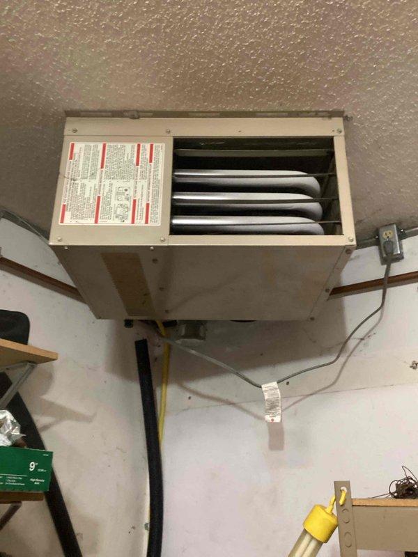 Responded to customer report of surge sound from garage heater during shutdown. Upon inspection of the wall-mounted unit, no abnormal sounds were detected during operation. Visual examination of heat exchanger, electrical connections, and gas line showed all components in normal working condition. No service actions required at this time as system is functioning properly.