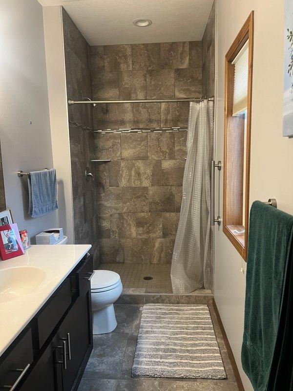 Responded to master bathroom service call for shower that continuously leaked from showerhead when off. Diagnosed faulty Moen posi temp cartridge in shower valve. Removed old cartridge, installed new replacement component, and restored water service to residence. Verified proper operation of shower controls with no further leaking.