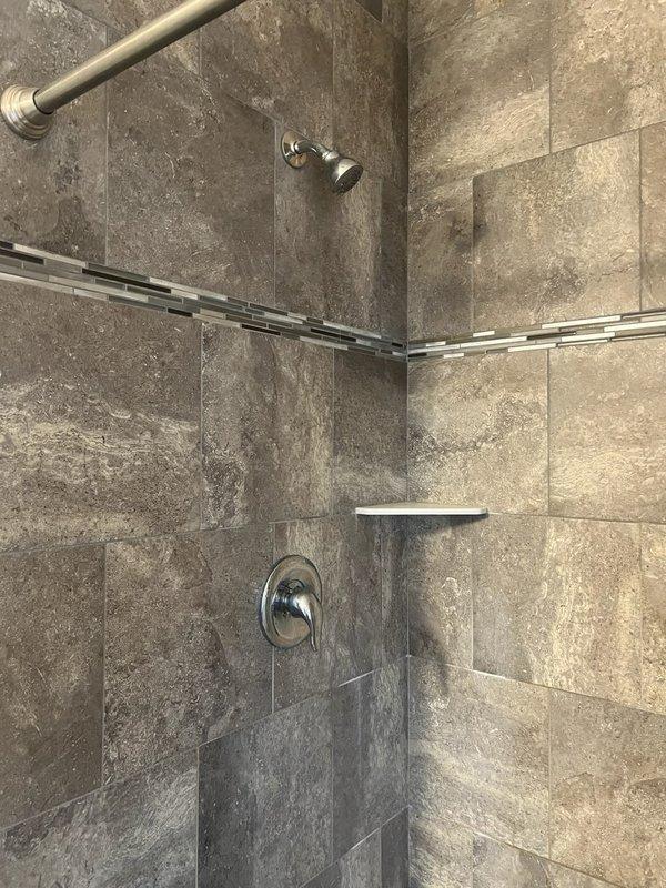 Responded to master bathroom service call for shower that continuously leaked from showerhead when off. Diagnosed faulty Moen posi temp cartridge in shower valve. Removed old cartridge, installed new replacement component, and restored water service to residence. Verified proper operation of shower controls with no further leaking.