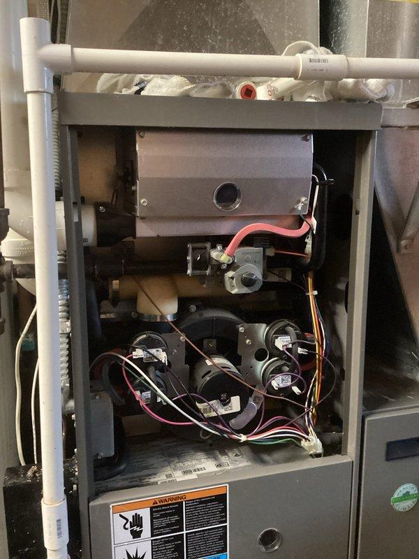 Responded to service call for water leakage during humidifier operation. Inspection revealed dual issues: clogged condensate drain line and compromised heat exchanger seal. Due to severity of heat exchanger failure and extensive water damage, complete system replacement was recommended and performed.