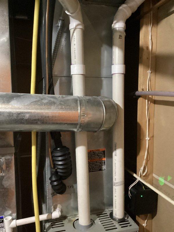 Performed scheduled tune-up maintenance on residential HVAC system per Agreement. Inspected furnace unit with PVC exhaust/intake pipes and associated ductwork. All components functioning properly; no issues identified during service.