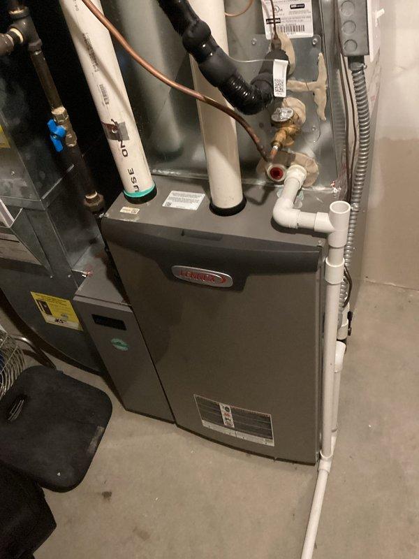 Performed scheduled maintenance agreement tune-up on Lennox residential HVAC system. Visual inspection of furnace, ductwork, and all connections (PVC venting pipes, drainage piping, and refrigerant lines) confirmed proper installation. System operating normally with no issues detected.